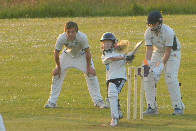 A nine-year-old Emma Corney bats as a guest player in an Under 14s game between Bradninch CC and Woodbury CC.