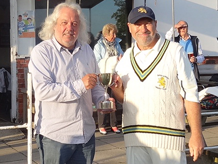 Devon captain Neil Matthews (right) receiving the Vase from Len Attard, the SW Counties National administrator