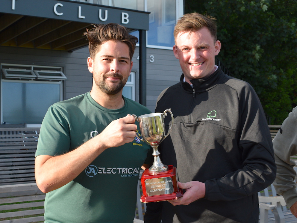 Bovey Tracey's cup-winning captain Lewis Hammett takes the Wombat Cricket Devon T20 cup from sponsor Harry Solomon<br>credit: Conrad Sutcliffe - no re-use without copyright owner's consent