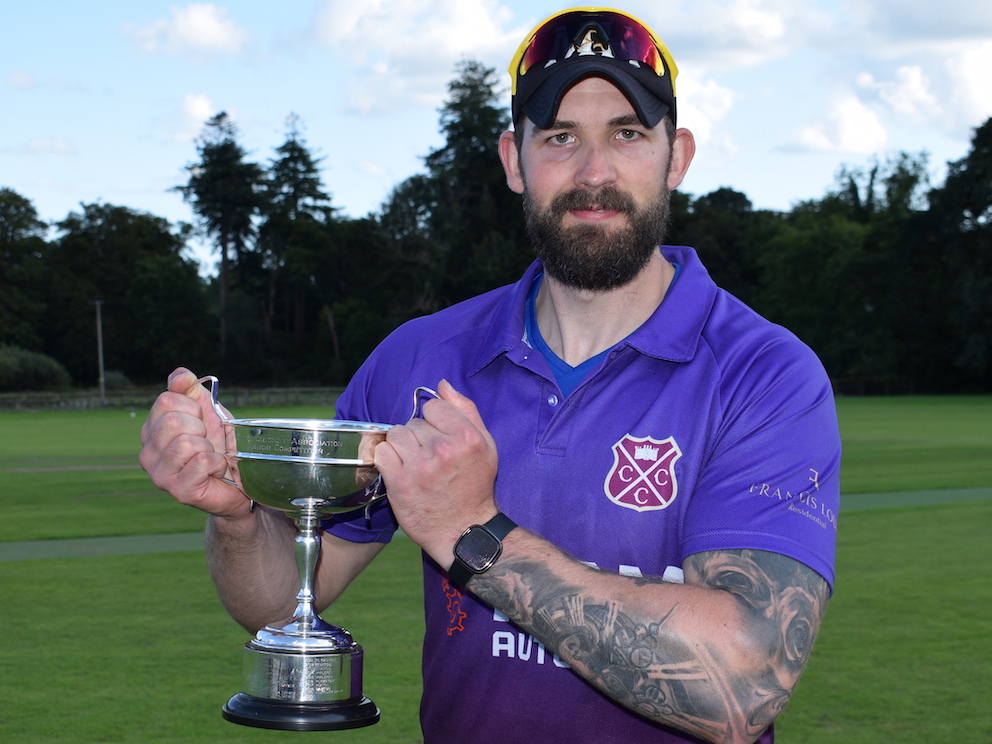 Cullompton skipper Brendon Parr shows off the Corinthian Cup after his side's eight-wicket win over Stoke Gabriel in the final<br>credit: Conrad Sutcliffe - no re-use without copyright owner's consent